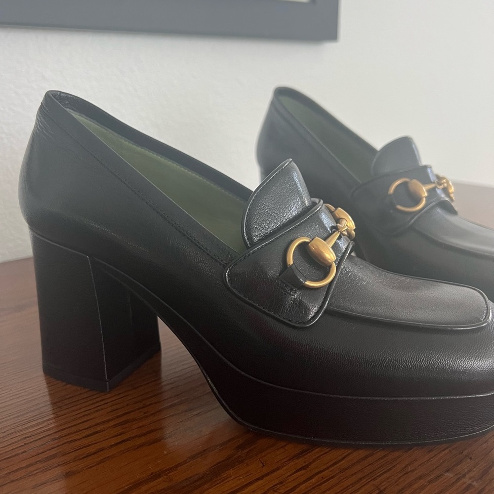 Gucci platform heeled horsebit loafers.